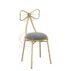 Charming gold stainless steel wedding chair featuring a romantic bow-tie laser-cut backrest, decorative seating for bridal showers
