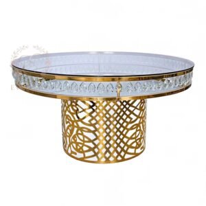 Luxury gold stainless steel event furniture featuring a round glass top and laser cut geometric base, wholesale banquet tables for wedding party, high-end decor supplier by EverGala.