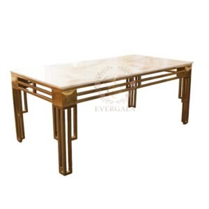 Luxury white banquet table featuring a long stone top and gold stainless steel legs, commercial grade furniture for wedding reception table set up, wholesale event decor by EverGala.