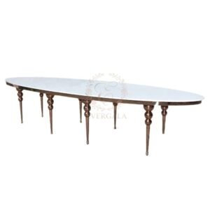 Luxury dining table featuring polished gold egg-shaped metal legs, unique oval sphere base design for high-end wedding event decor.