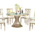 Luxury black glass top event table featuring a PVD coating gold lattice base, modern wedding furniture from Foshan manufacturer, commercial grade.