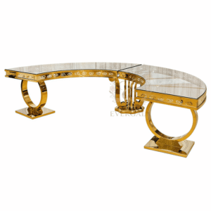 EverGala luxury gold stainless steel curved VIP table with unique circular hollow base and glass top, designed for modular serpentine banquet layouts in upscale weddings and premium events.