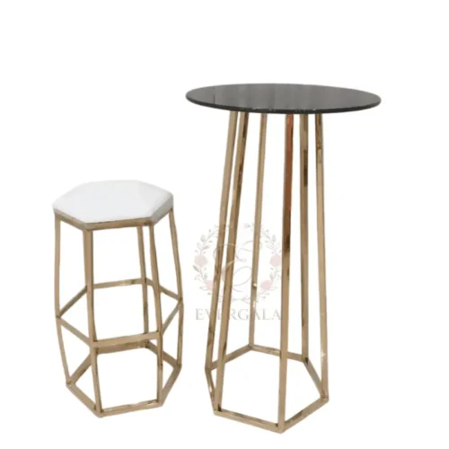 Contemporary cocktail table featuring a geometric hexagonal gold frame and a sleek black round top. Perfect for modern weddings, corporate events and upscale party venues.