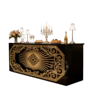 Sophisticated black and gold mirrored bar counter with baroque decorative elements.Ideal for luxury weddings, gala events, casino parties and vintage-themed receptions.